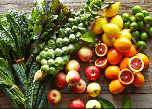 a group of fruits and vegetables on a wood surface Healthy Weight Loss Diets Lancashire